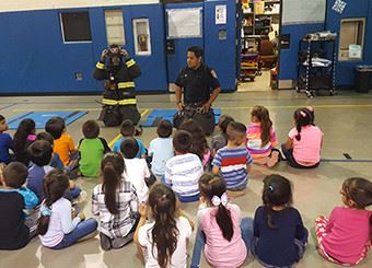 Firemen giving demonstration at Horizon School
