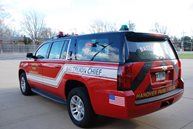 The front of a red and black vehicle.